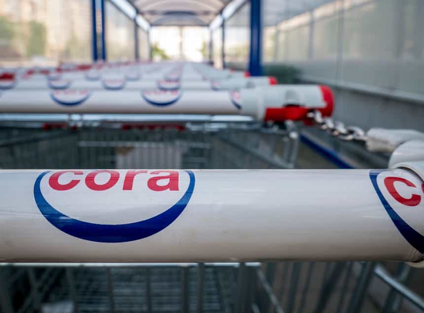 BucharestRomania – 04.27.2020 Shopping carts belonging to Cora Hypermarket. Logo of the French retailer Cora