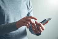 man hand holding smart phone